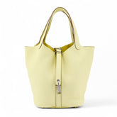 Arvelle Lock Small Sunlit Yellow Soft Grain Calfskin Bucket Bag - Arvelle Paris