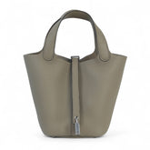 Arvelle Lock Small Desert Beige Soft Grain Calfskin Bucket Bag - Arvelle Paris