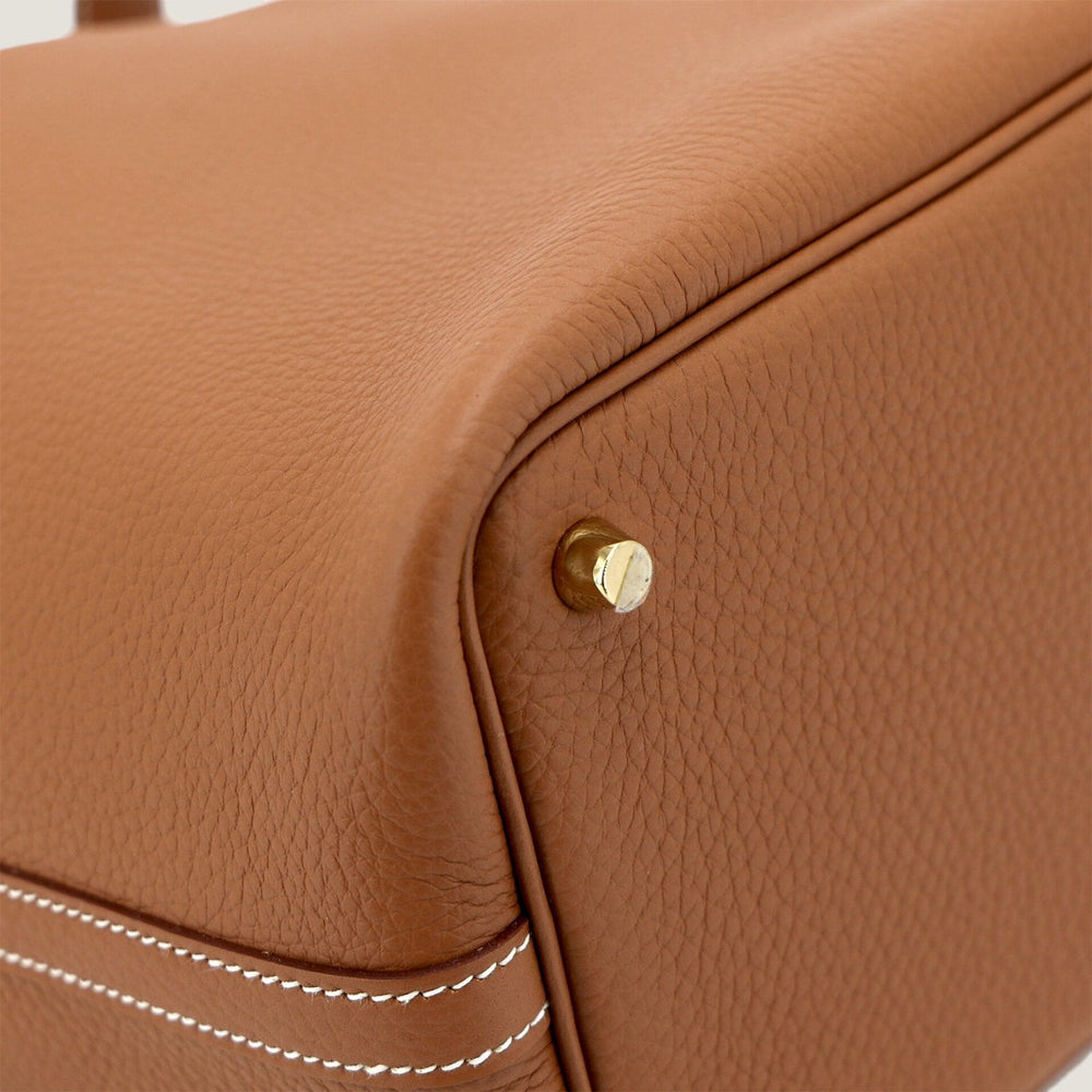 Arvelle Lock Small Champagne Gold Soft Grain Calfskin Bucket Bag - Arvelle Paris