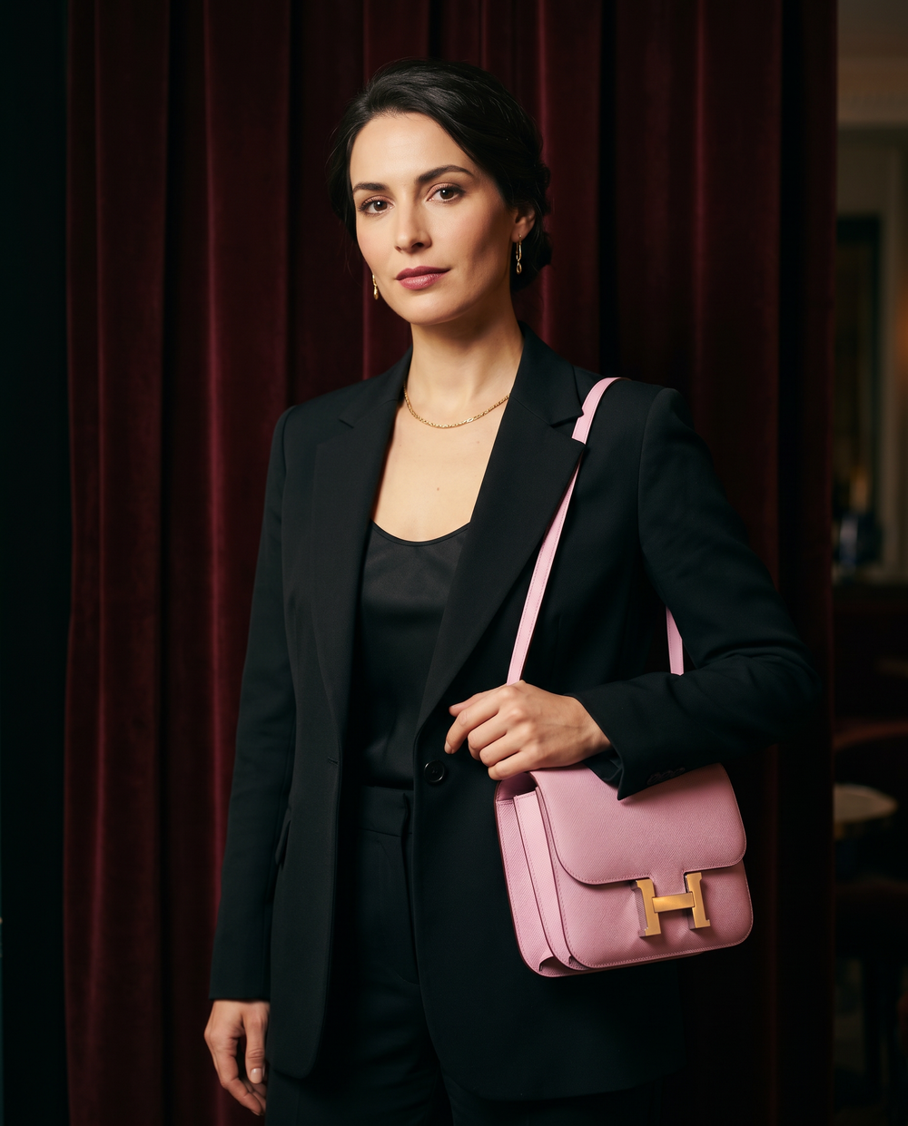 Arvelle Paris luxury handbag — editorial styling, held by model in Parisian setting