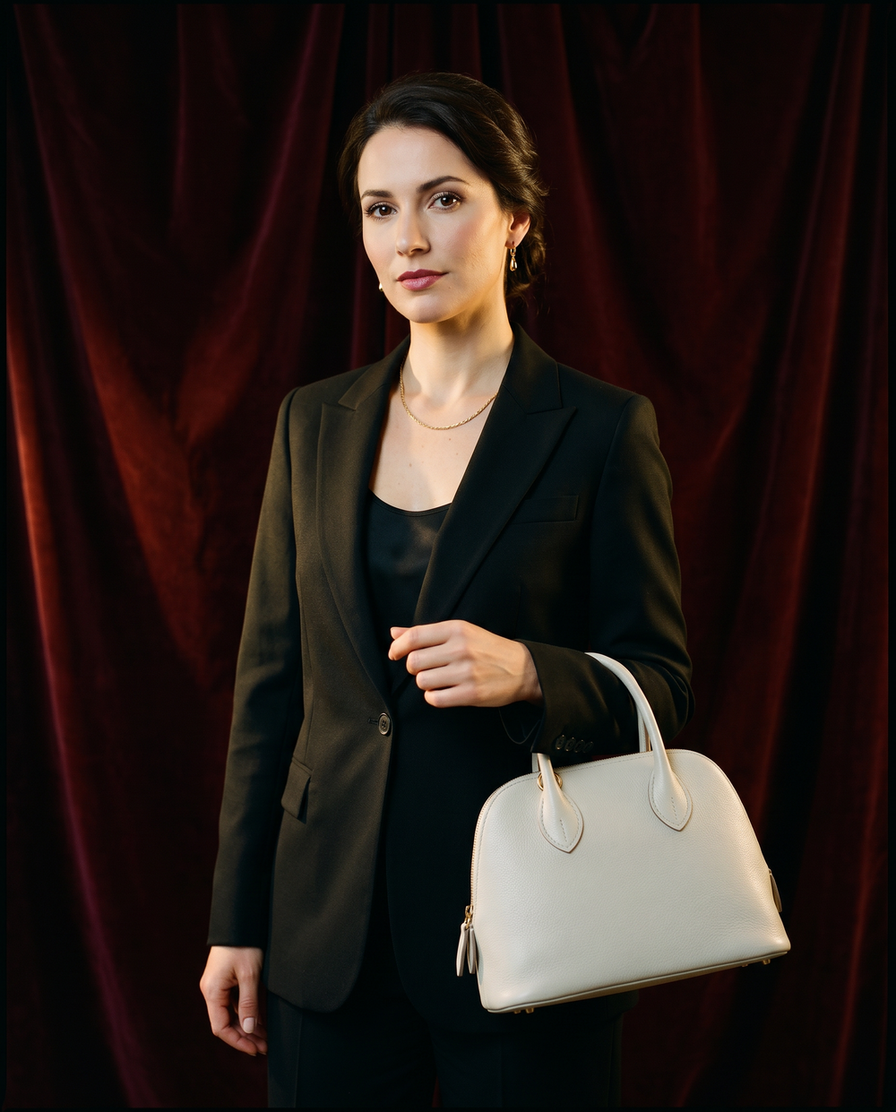 Arvelle Paris luxury handbag — editorial styling, held by model in Parisian setting
