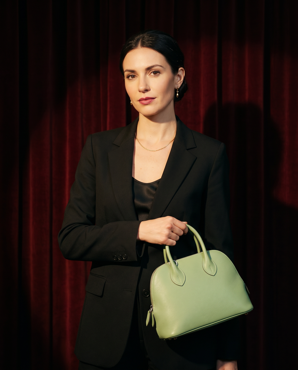 Arvelle Paris luxury handbag — editorial styling, held by model in Parisian setting