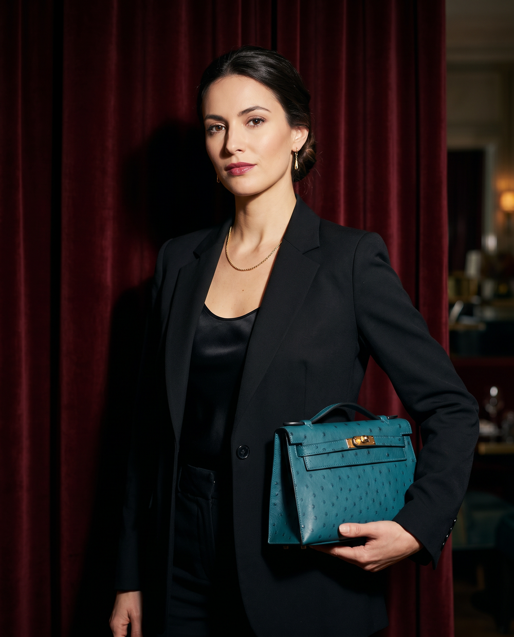 Arvelle Paris luxury handbag — editorial styling, held by model in Parisian setting